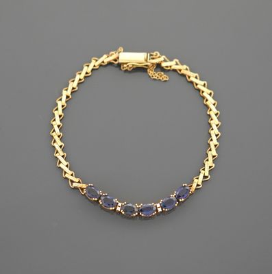 Bracelet en or jaune 18K 750 millièmes à mailles torsadées e…