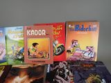 several children ' s books are lined up on a table