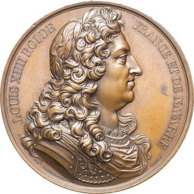 une image représentant une médaille de bronze sur laquelle figure le visage d'un homme
