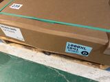 a cardboard box on a pallet on the floor