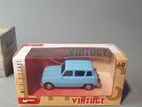 a small toy car in a box on a table