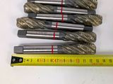 six different sizes of drill bits are shown next to a ruler