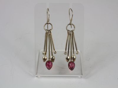 pink tourmaline and sterling earrings on clear acrylic stand