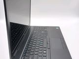a black laptop with a blue keyboard on a white surface