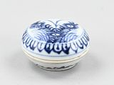 a small blue and white bowl with a bird design on it