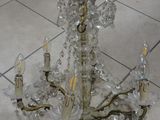 a chandelier that is sitting on a tile floor