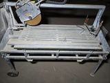 a machine that is cutting a sheet of metal