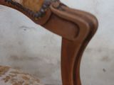a chair that has a brown and white pattern on it