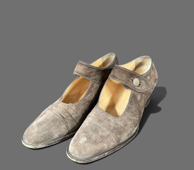 an image of a pair of shoes on a gray surface