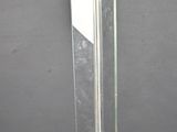 a very long knife that is hanging on the wall