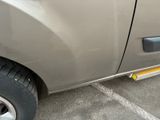 a close up of a car ' s side door with a sticker on it