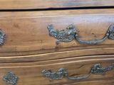 a wooden dresser with a mirror on top of it