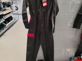 a black and red work suit on display in a store
