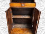 a small wooden cabinet with a drawer on top of it