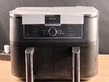 an image of a coffee machine on a wooden table