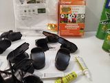 many items that are on the table including sunglasses, a bottle of insect repellent and a can of insect repellent