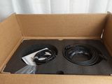 a cardboard box with two speakers inside of it