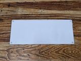 a white plate sitting on a wooden table