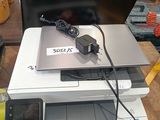 a printer sitting on top of a printer on a table