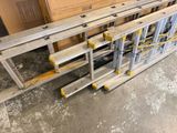 several steel frames are stacked on top of each other in a warehouse