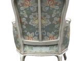 an image of a chair with a floral upholstered back