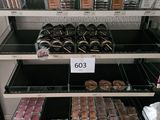 a lot of makeup products on the shelves in the store