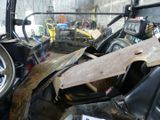 a picture of a truck with a wooden board in the front seat