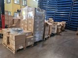 many boxes stacked on a pallet in a warehouse