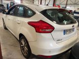 a white car that is parked in a garage