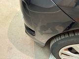a close up of a car ' s front wheel and tire