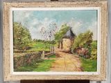 un tableau représentant une maison, posé sur un chevalet dans une pièce