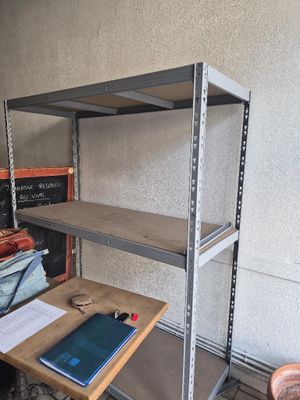 a desk with a laptop on it in a room