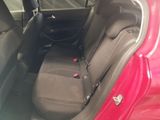 a red car with two seats in the back of it