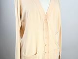 beige cardigan sweater on a mannequin display on a mannequin stand