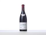 a bottle of red wine sitting on top of a table