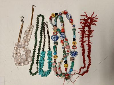 a lot of necklaces that are on a table