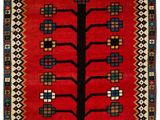 a red rug with a tree of life on it