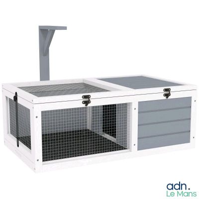 a close up of a white and grey cage with a door open