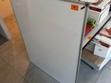 a refrigerator that has a bunch of boxes in it