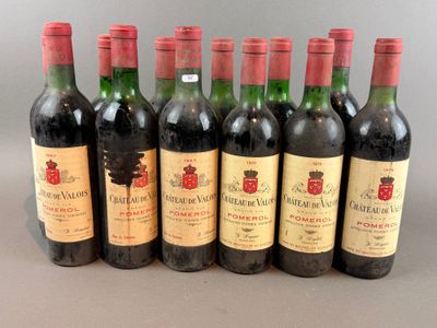 six bottles of wine are lined up in a row on a table