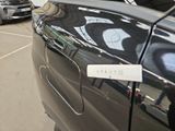 many cars parked in a parking lot with a sign on the side of the car