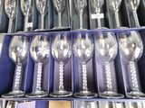 a lot of wine glasses that are in a box