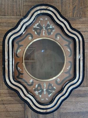 a mirror that is on the wall on the floor