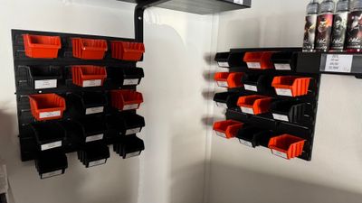 many bins on the wall in the room