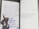 a book with a drawing of a goat on it