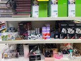 a lot of stationary supplies on the shelves in the store