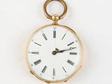 a gold pocket watch with roman numerals on the face
