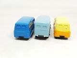 three toy cars that are sitting side by side on a white surface