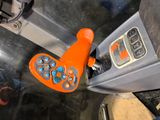 a close up of a remote control in a vehicle