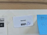 a white refrigerator with a blue sticker on it and a blue sticker on the refrigerator door